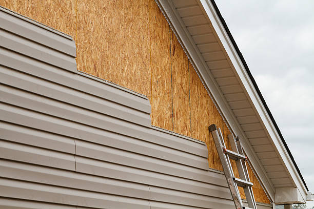 Professional Emergency Siding Repair technician working in New Springfield, OH